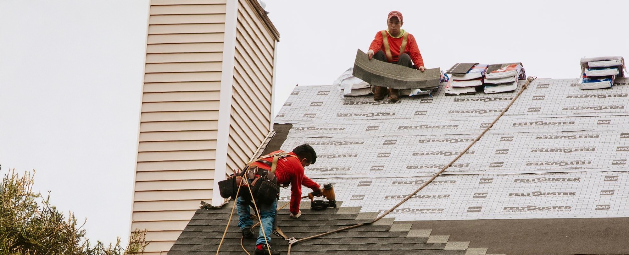 shingle replacement being done by roofing contractors in Woonsocket