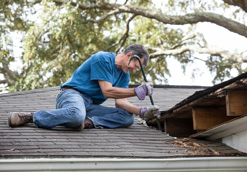 Homeowner doing a roof repair in Westerly